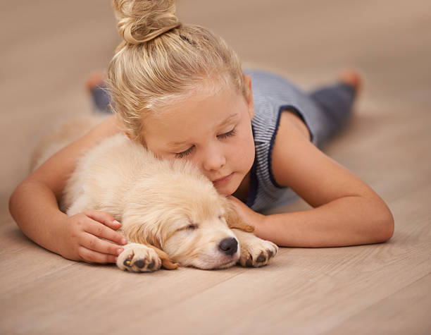 Baby girl with puppy | Floor Coverings of Winona